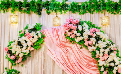 Elegant Wedding Decor: Pink Roses & Draped Fabric Backdrop