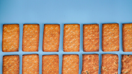 Flat lay view of biscuit on light blue background