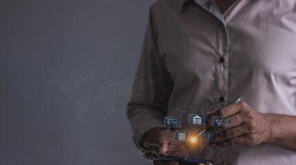 Young man with smartphone mobile hand holding a pen touching to visualize money growth The phone screen displays graphs and charts showing increasing investment and savings trends, increased