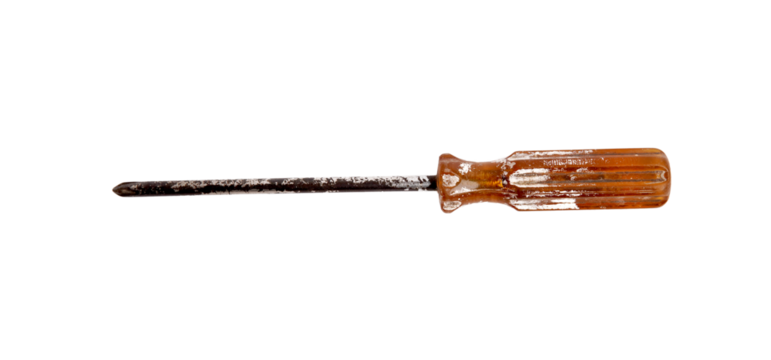 A well used, rusty Phillips head screwdriver with an amber handle.
