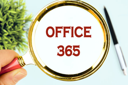OFFICE 365 words written through a magnifying glass, top view on a light background