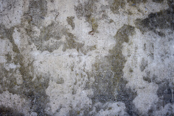 Abstract gray and white concrete wall texture. A weathered background with water stains and a rough...