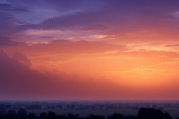 Fototapeta premium breathtaking summer sunrise painted with soft hues of pink orange and purple illuminates sky