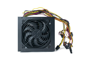 A computer power supply unit PSU with its fan and various colored cables is isolated on a clean white background.