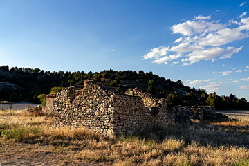 Rural architecture in Spain, abandoned and semi-ruined due to migration to cities, with daylight illumination.