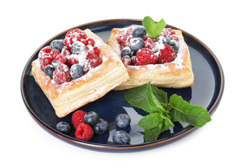 Tasty puff pastries with berries, powdered sugar and mint isolated on white