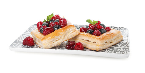Tasty puff pastries with berries and mint isolated on white