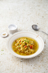 Homemade lentil soup served with microgreens