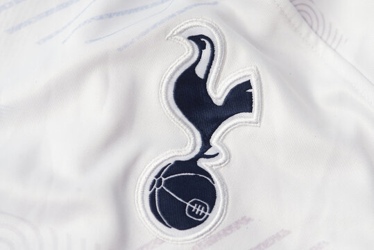 Kyiv, Ukraine - September 18, 2025:  Tottenham Hotspur football club crest with cockerel and ball on white jersey, close-up editorial image.