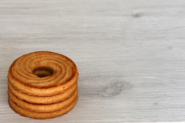 Ring-shaped shortbread cookies on a light background – breakfast or snack sweets