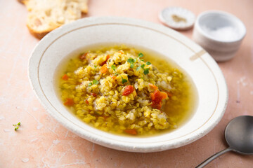 Homemade lentil soup served with microgreens