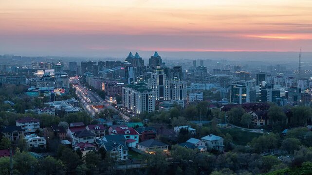 From evening to night. Sun set of Almaty city. Almaty panorama.