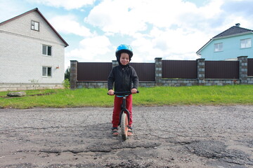 little boy on a balance bike