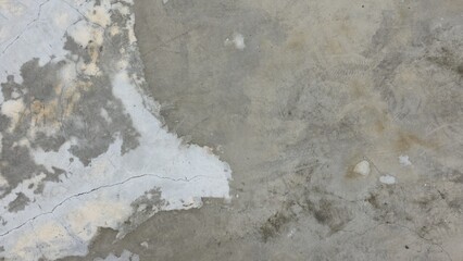 Old grey concrete floor with stains, fading, peeling paint, scratches, sidewalk, road surface, texture, and background image.