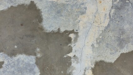 Old grey concrete floor with stains, fading, peeling paint, scratches, sidewalk, road surface, texture, and background image.
