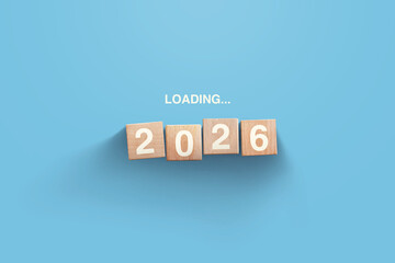 2026 New Year Loading. Loading bar with wooden blocks 2026 on blue background. Start new year 2026 with goal concept, action plan, strategy, new year business vision