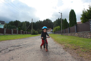 little boy on a balance bike