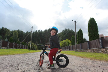 little boy on a balance bike