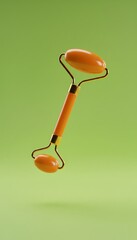 Orange facial massage roller with dual stone heads and golden handle isolated on green background. Beauty tool for skincare, massage and relaxation.