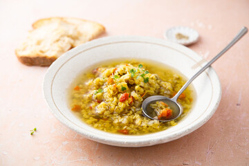 Homemade lentil soup served with microgreens