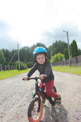 little boy on a balance bike