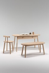 Fototapeta premium A light beige wooden desk and bench set against a neutral background, showcasing simple, clean lines and a modern aesthetic.