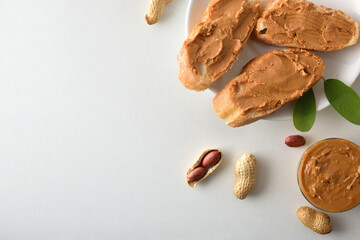 Bread with peanut butter isolated on white table