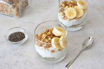 Healthy Yogurt Parfaits with Granola and Banana Slices top view