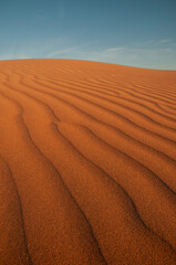 Natural designs and shapes in the sand, caused by the wind.