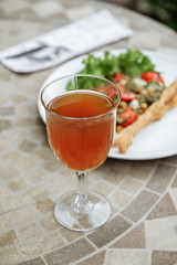 Refreshing drink and salad on a table