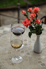 Wine glasses and roses on a table
