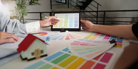 Interior Design Consultation. Collaborating on color selections for a home project.