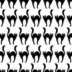 Black cats silhouettes. Seamless pattern on transparent background, vector.