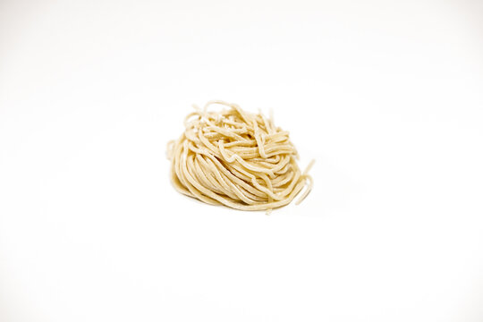 raw spaghetti on a white background
