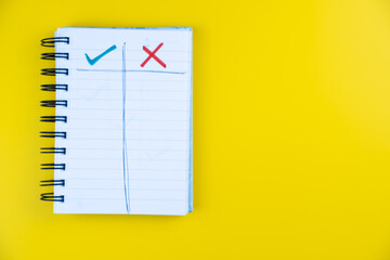 Do's and Dont's Dos Donts on a spiral notebook on a yellow background, Do and do not business analysis, positive negative background