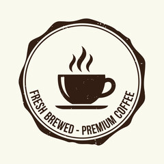 Obraz premium Vintage style fresh brewed premium coffee emblem,A circular emblem with a steaming coffee cup and saucer, featuring text that reads 'Fresh Brewed Premium Coffee'.
