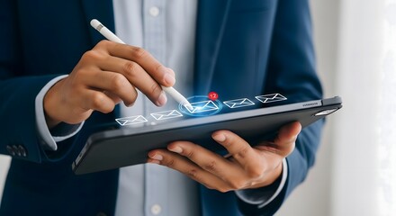 Man in suit using tablet with stylus and email icons displaying twelve unread messages notification
