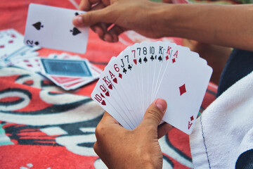 playing cards in the hand