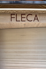 Sign for the Fleca bakery and pastry shop.