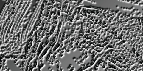 Microscopic Metallic Surface with Intricate Lamellar and Granular Textures.