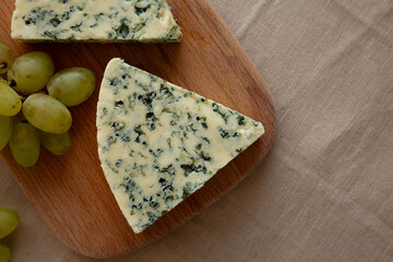 Delicious Cheese Danablu on a wooden board, top view. Copy space.