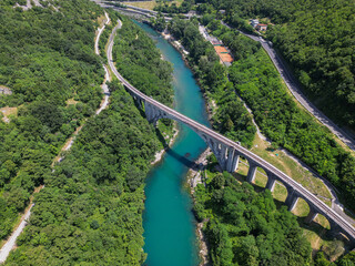 Picturesque, idyllic and vibrant aerial drone view of the Solkan railway bridge and emerald Soca river. Solkan, Slovenia