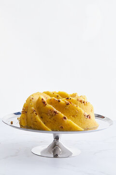 halva on a silver plate on a marble background