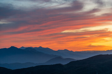Fototapeta premium Overlooking magnificent sunset glow over mountains