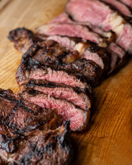 Sliced middle-rare steak on a cutting board