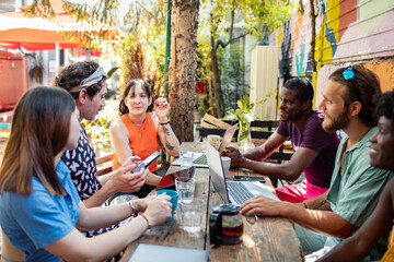 Group of friends collaborating outdoors