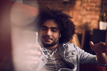 Relaxed man listening to music