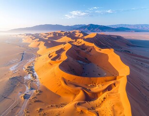 Desert dunes shaped like giant waves frozen in time, photorealistic aerial shot.