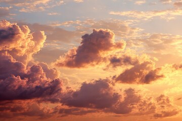 Fototapeta premium Colorful clouds during sunset create a stunning sky over a tranquil landscape filled with warm hues