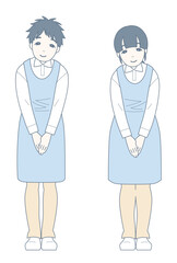 軽くお辞儀をしながら微笑む介護士